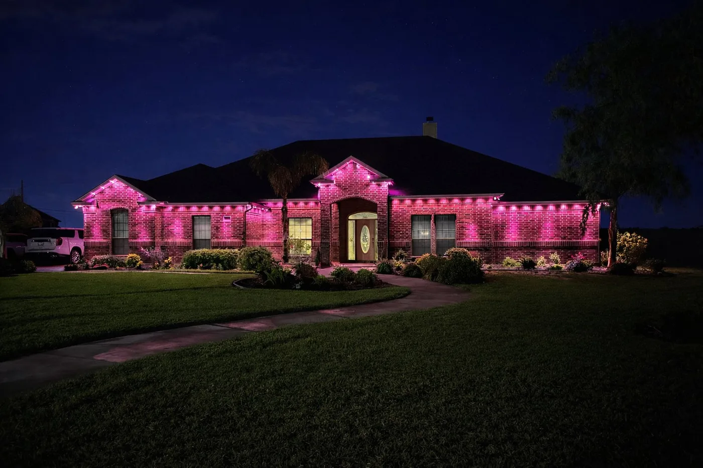 Valentine's Day pink permanent roofline lighting on home in Corpus Christi TX
